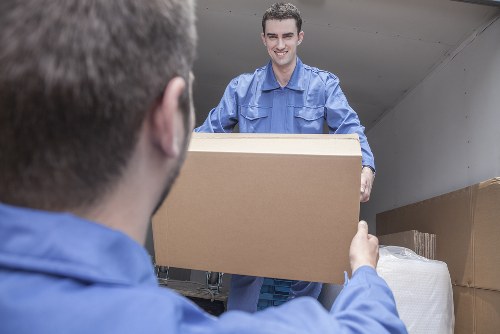 Student removals in Sutton with packed boxes and a moving van