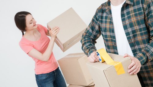 Professional movers loading furniture for a Sutton relocation