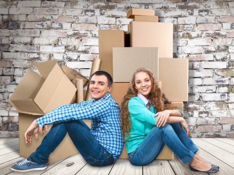 Professional movers handling furniture during house removals in Sutton