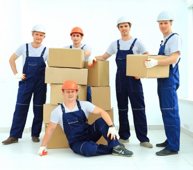 Moving boxes and furniture for a home removal in Sutton