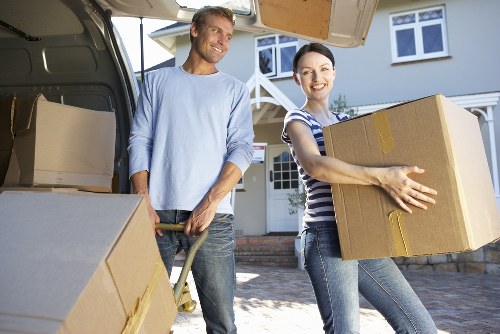 Removals team preparing furniture for safe transport in Sutton