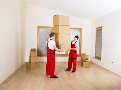 Professional office relocation team handling equipment in Sutton